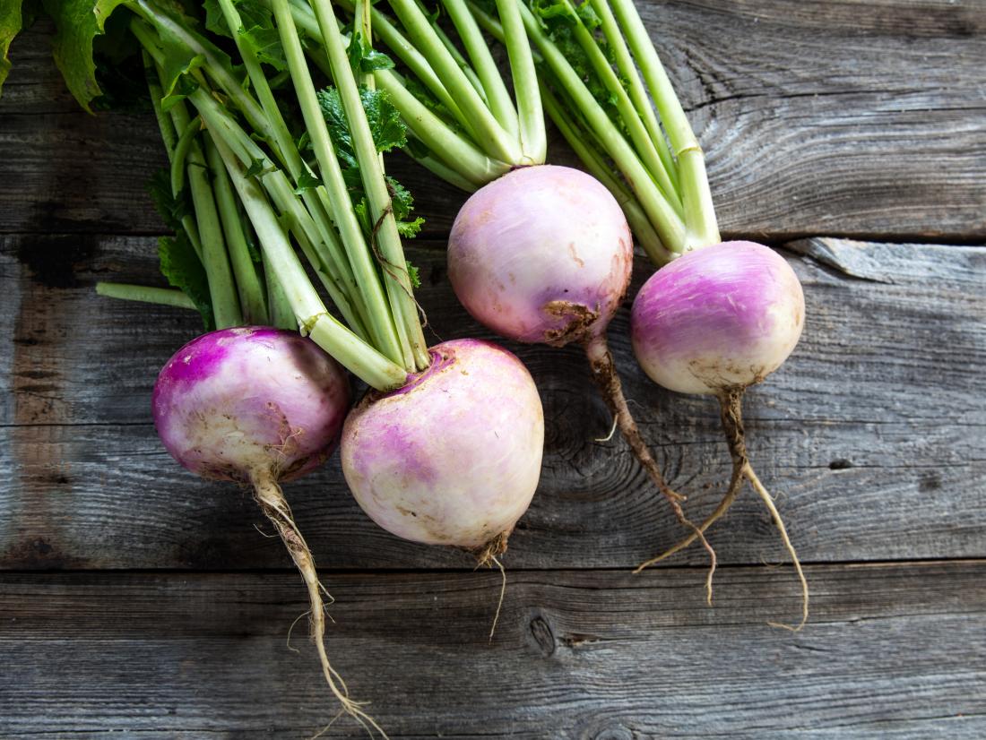 a-bunch-of-turnips-on-a-table-1730360319.jpg